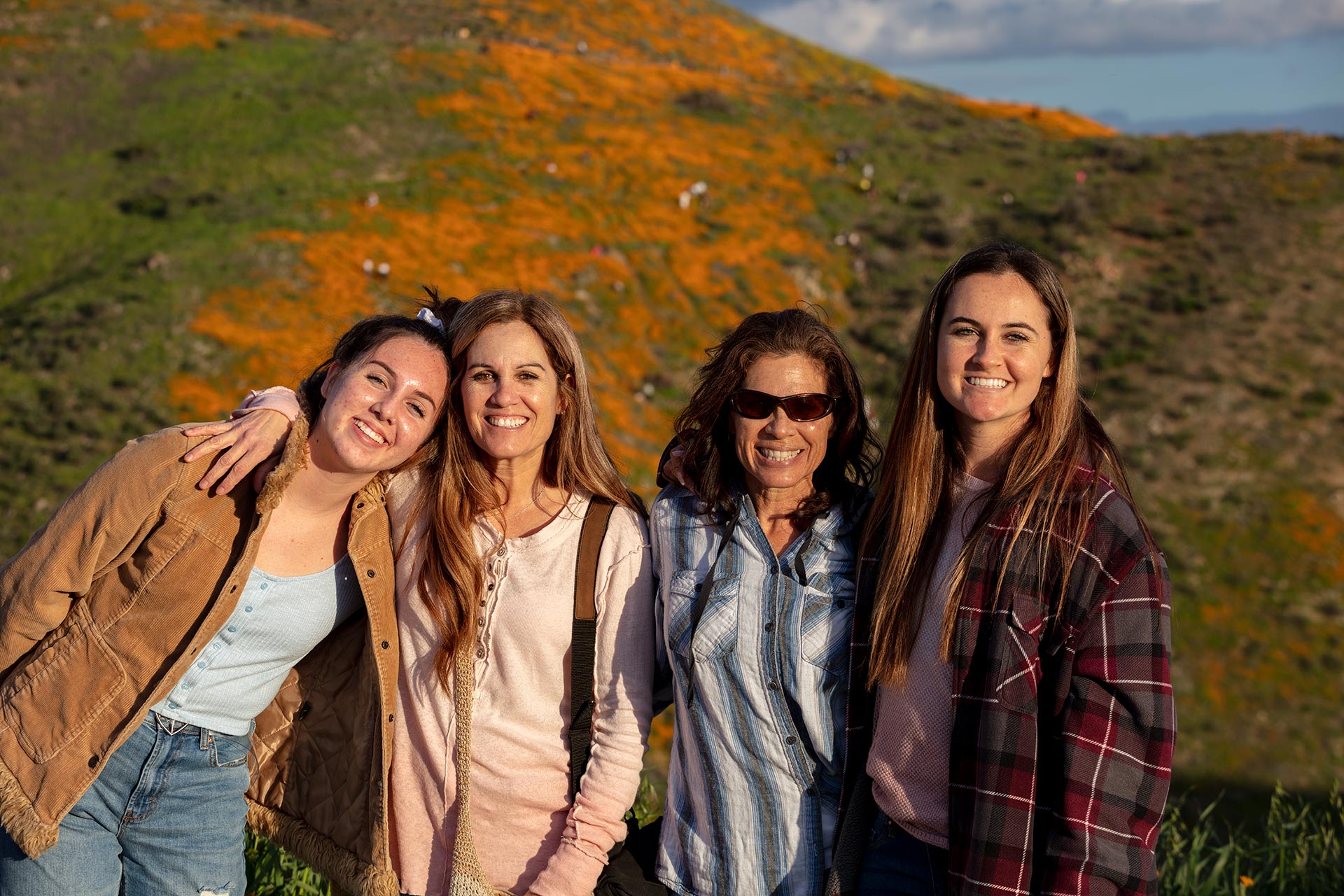 family standing at Walker Canyon poppies superbloom